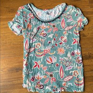 Floral top with tassels around the trim